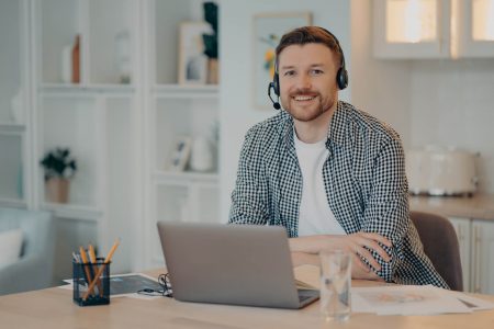 bearded-man-sits-at-desktop-wears-headset-sits-at-2021-10-21-03-37-44-utc.jpg